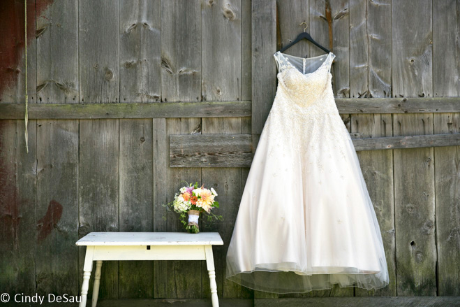 wedding dress on barn door