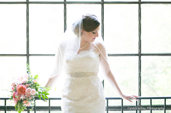 High key photograph of bride in front of window.