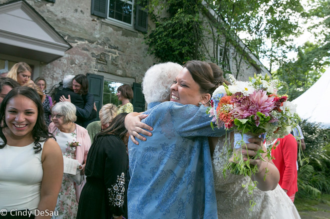 Grandmom hugs the bride
